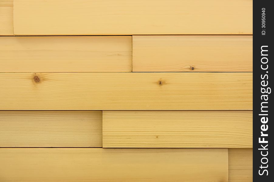 Detail of a modern wooden background with blocks and parallel lines. Detail of a modern wooden background with blocks and parallel lines.