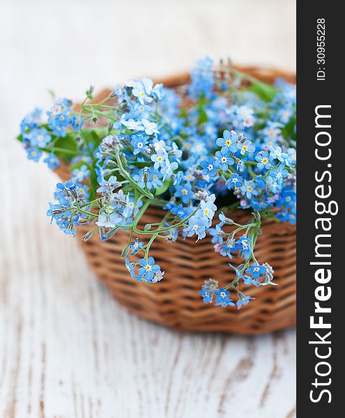 Bunch of forget-me-nots flowers in basket