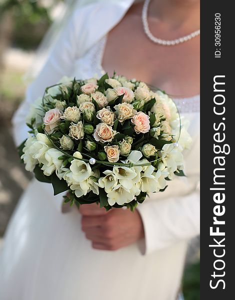 Bride holding a wedding bouquet. Bride holding a wedding bouquet