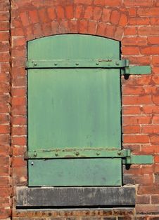 Green Metal Door In A Brick Wall. Royalty Free Stock Photos Green Metal Door In A Brick Wall. Royalty Free Stock Photos