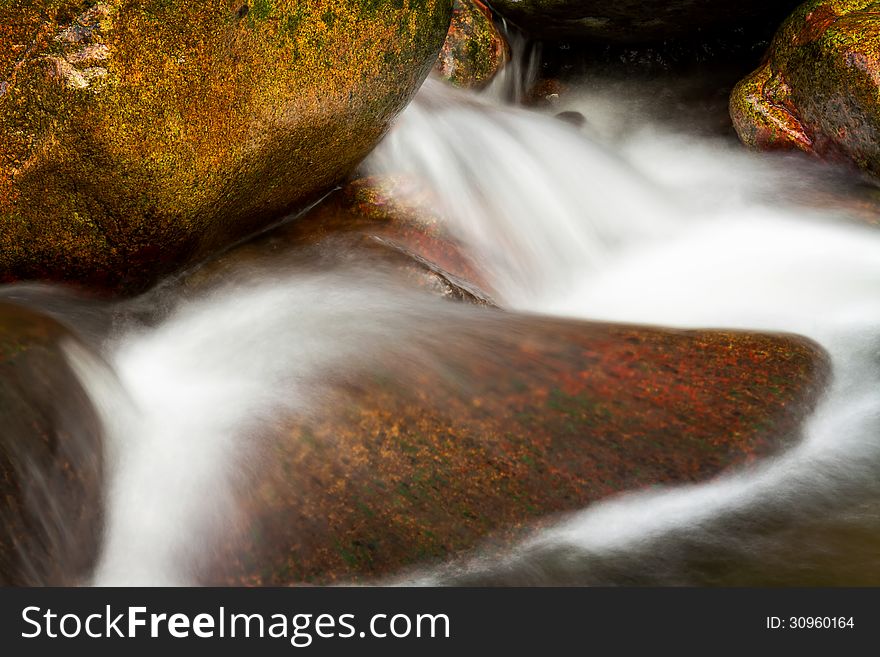 Beautiful veil cascading waterfall, mossy rocks