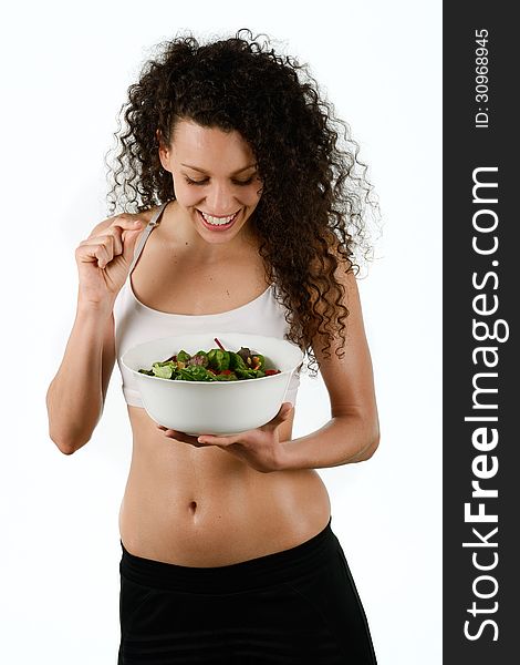 Portrait of beautiful young mixed woman with salad, isolated on white