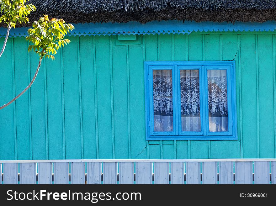 Detail of traditional blue painted house in Danube Delta
