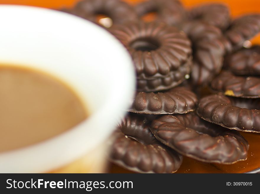 Coffee cup and chocolate biscuits