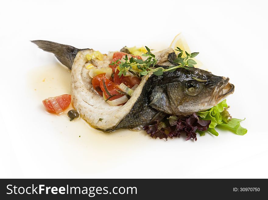 Baked sea bass stuffed with vegetables