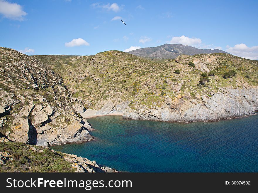 Cala de Sa Cebolla, a popular tourist destination along the path to the Cala Nans Lighthouse in Cadaques Spain. Cala de Sa Cebolla, a popular tourist destination along the path to the Cala Nans Lighthouse in Cadaques Spain