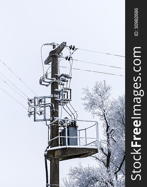 Old Concrete Power-line With Transformer And Winter-tree