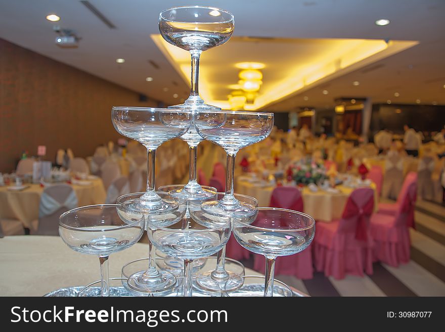 Stacked champagne glasses on a wedding table