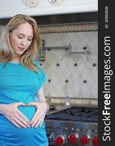 Pregnant woman touching her belly