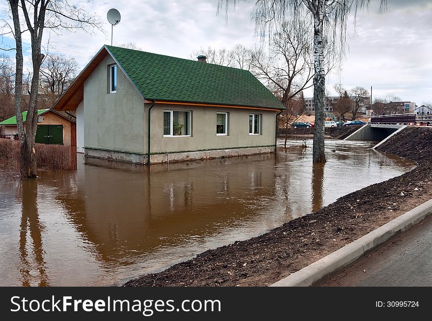 Flooding river flooded town house