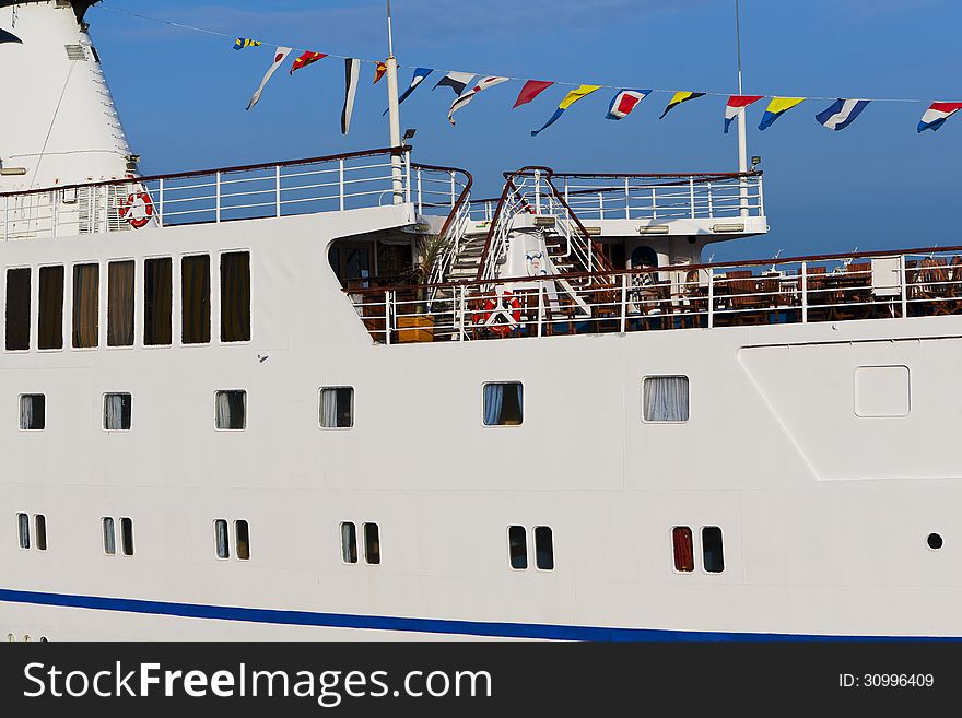 Board and deck of standing in the port cruise liner. Board and deck of standing in the port cruise liner