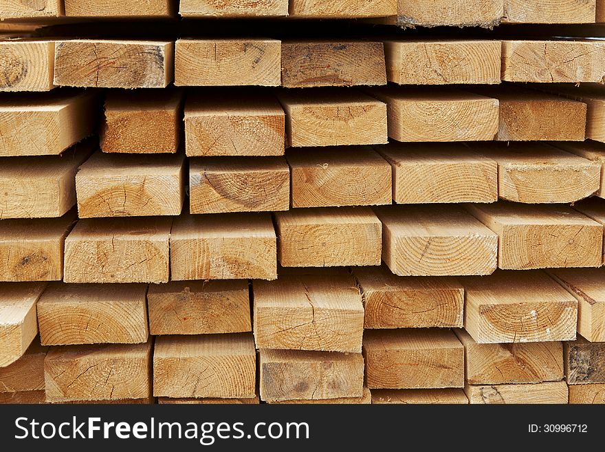 Stack of pine boards on building materials warehouse