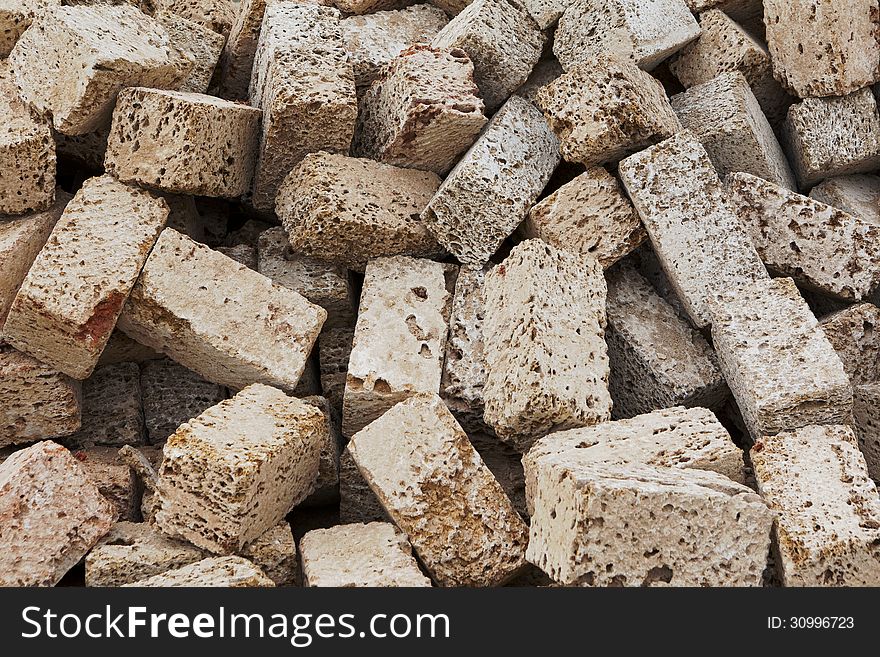 Pile of shell rock concrete blocks background