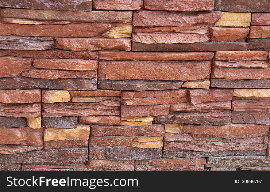 Stone wall, flat stacked as background and texture. Stone wall, flat stacked as background and texture