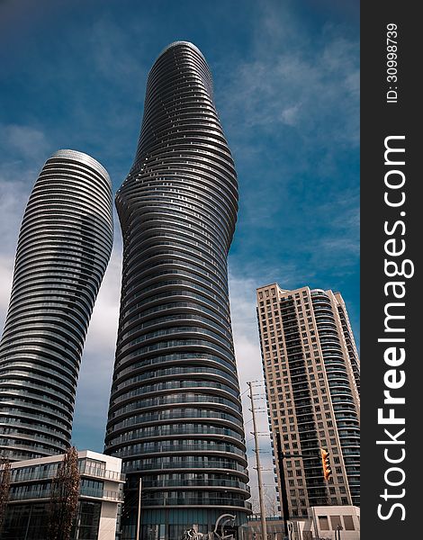 Main objects two tall modern style shape buildings. Main objects two tall modern style shape buildings