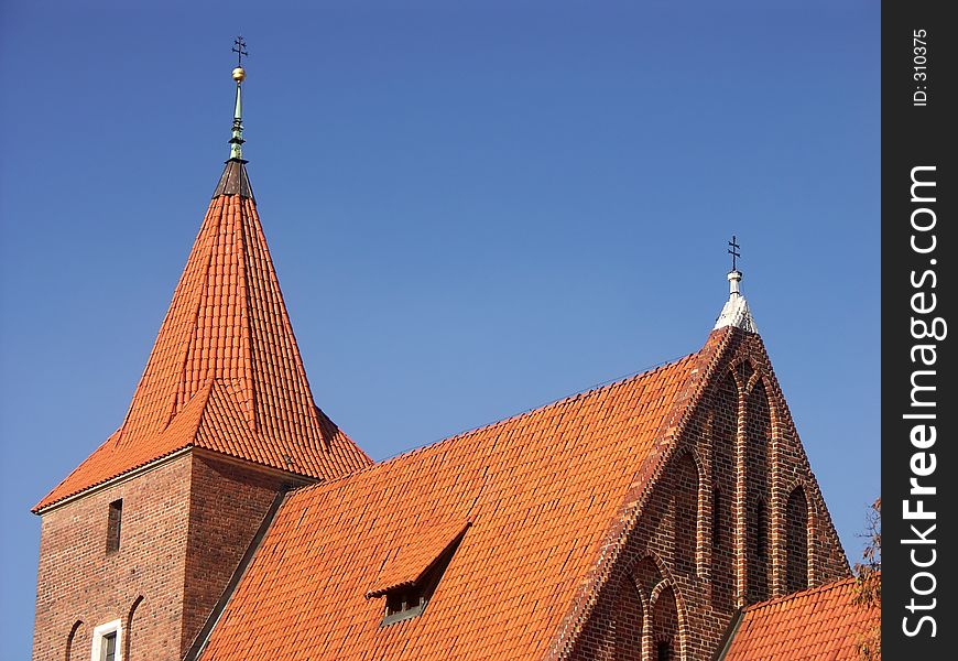 Roman Catholic church with red roof. Roman Catholic church with red roof