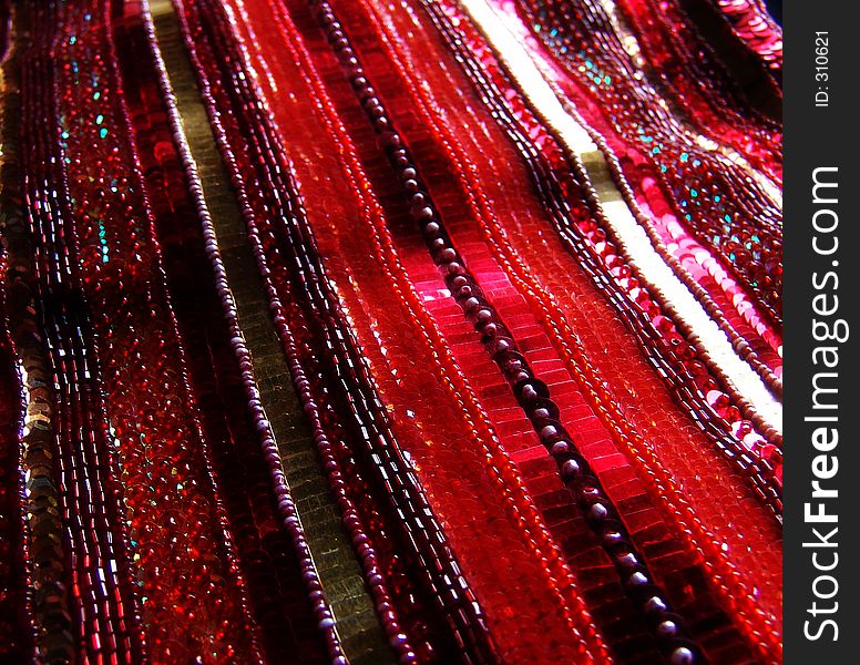 Sequins and beads sewn in lines. Sequins and beads sewn in lines.