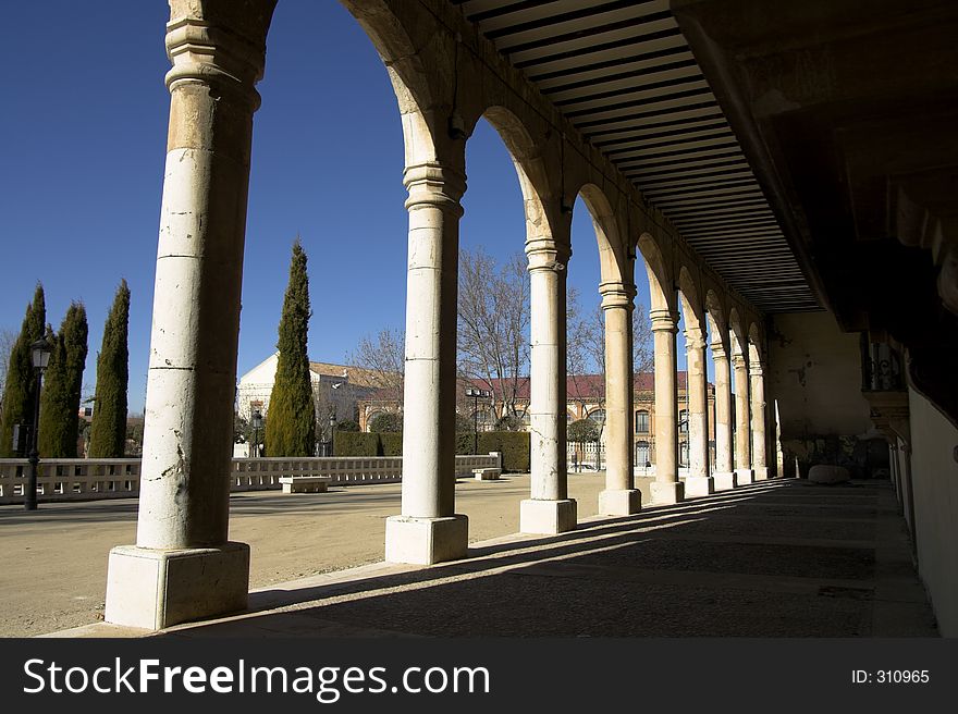 Light and shadows going through the archs of an old building.