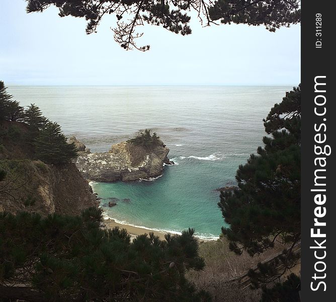 Turquoise water and rocks in a small cove at Julia Pfeifer Burns State Park. Turquoise water and rocks in a small cove at Julia Pfeifer Burns State Park