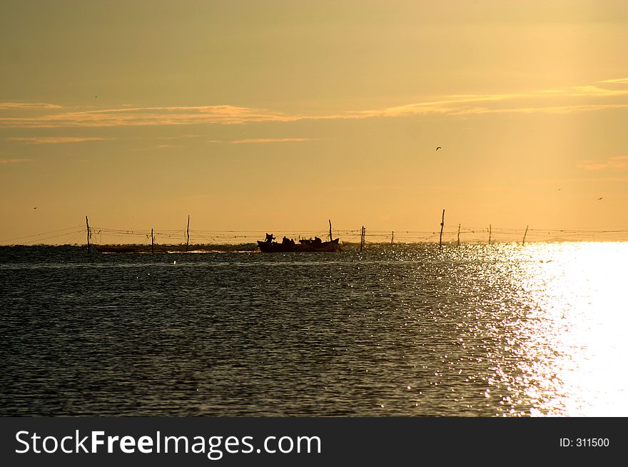 Fishermans at work in the early morning. Fishermans at work in the early morning