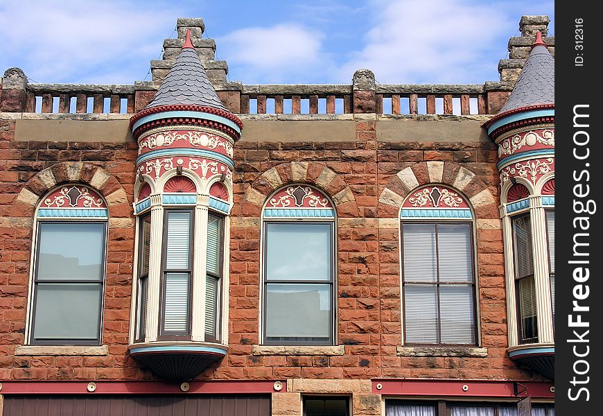 Gingerbread architecture, featuring native sandstone, decorates many of the turn of the century buildings in historic downtown Guthrie, Oklahoma. Gingerbread architecture, featuring native sandstone, decorates many of the turn of the century buildings in historic downtown Guthrie, Oklahoma.