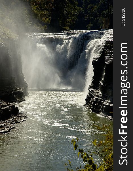 A waterfall in the middle of a big river gorge. A waterfall in the middle of a big river gorge