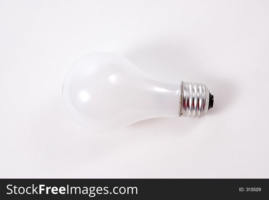 A standard incandescent lightbulb photographed on a white background
