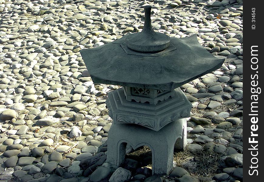 Japanese garden lamp in shadow. Japanese garden lamp in shadow