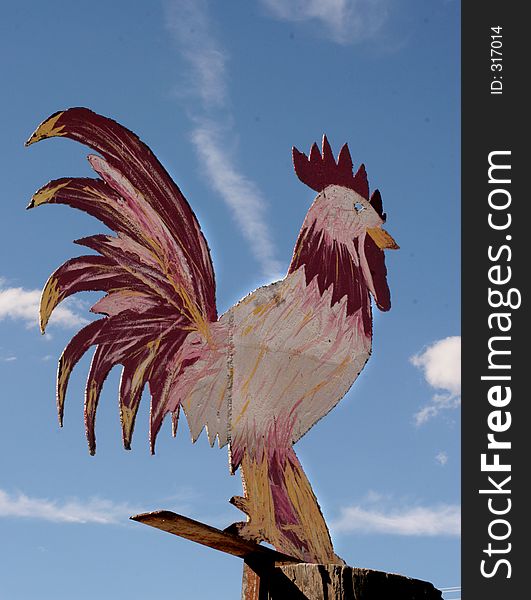 Giant Chicken Sign Backed By Blue Sky. Giant Chicken Sign Backed By Blue Sky