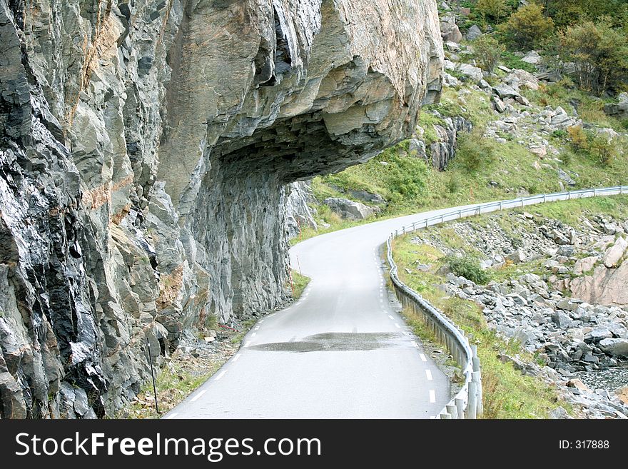 A cliff hanging over the road in Roan, Norway. A cliff hanging over the road in Roan, Norway.