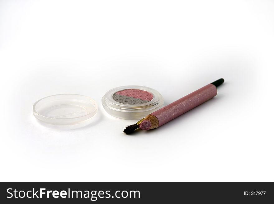 Eyebrush,eyeshadow,eyepencil on white background. Eyebrush,eyeshadow,eyepencil on white background