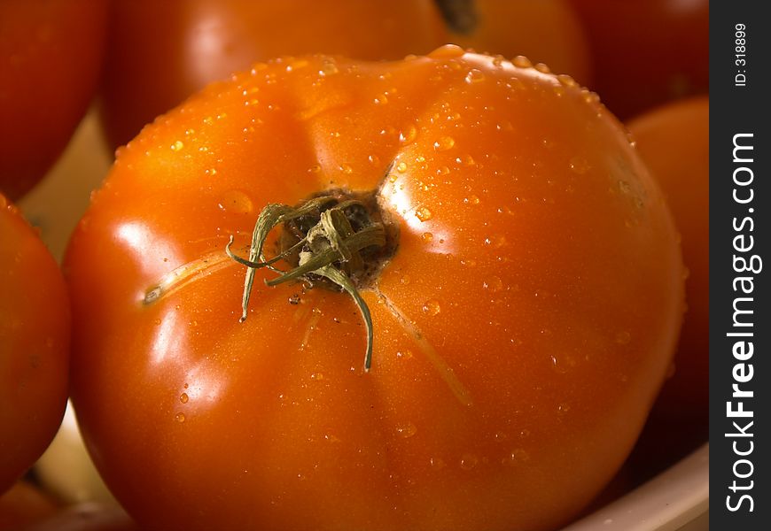 Closeup of a wet tomato,shallow dof. Closeup of a wet tomato,shallow dof