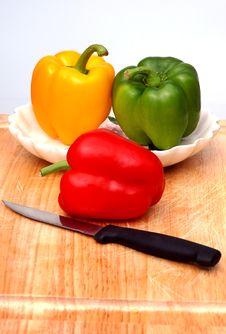Peppers On The Cutting Board Royalty Free Stock Photos