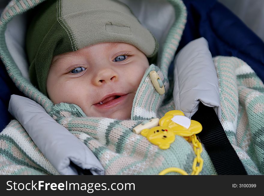 Happy baby infant in his pram