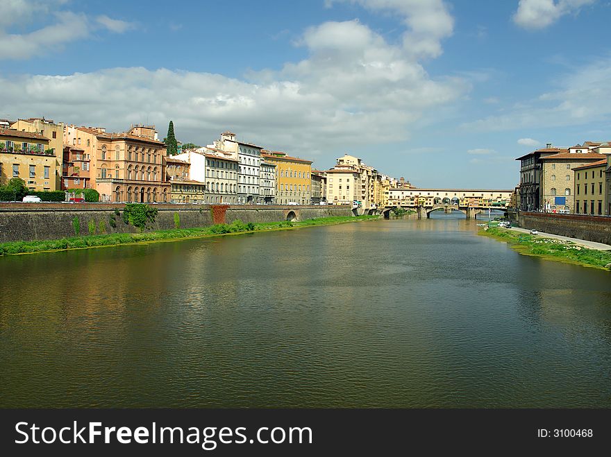 The Arno River,  Ponte Vecchio and old buildings in Florence (Firenze), Italy. The Arno River,  Ponte Vecchio and old buildings in Florence (Firenze), Italy.