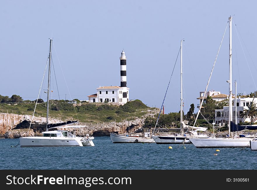 Little harbour with lighthouse in mallorca, Spain. Little harbour with lighthouse in mallorca, Spain