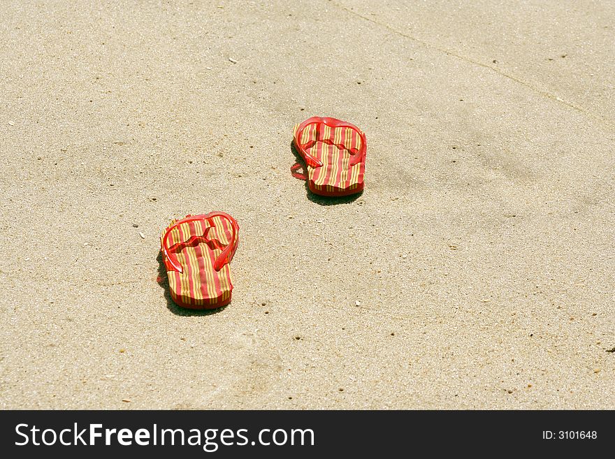 A pair of Flip-flops on the beach