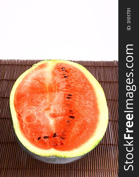 Background of brightly lit red watermelon slices.