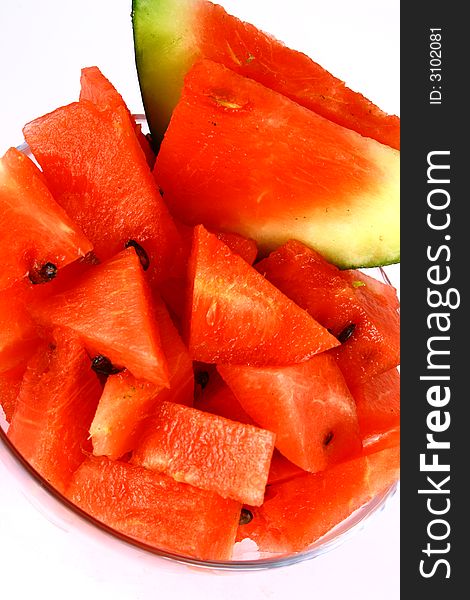 Background of brightly lit red watermelon slices. Background of brightly lit red watermelon slices.