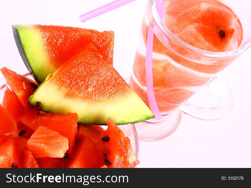 Background of brightly lit red watermelon slices. Background of brightly lit red watermelon slices.