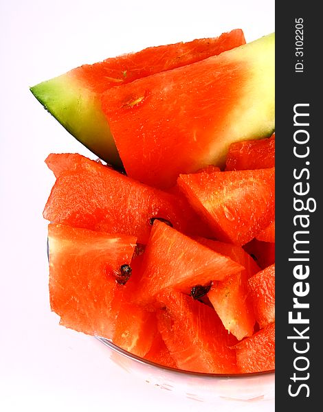 Background of brightly lit red watermelon slices. Background of brightly lit red watermelon slices.