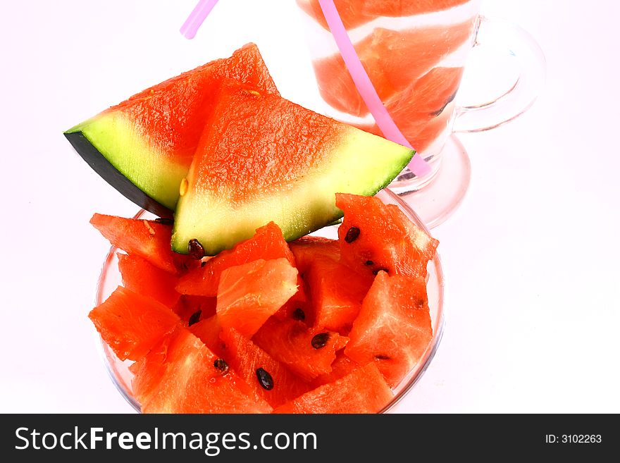 Background of brightly lit red watermelon slices. Background of brightly lit red watermelon slices.