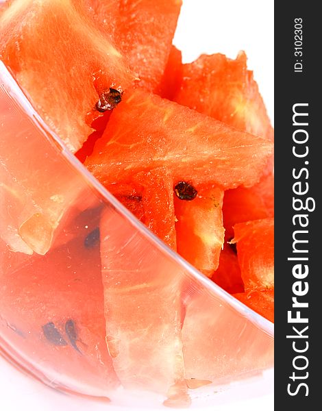 Background of brightly lit red watermelon slices.