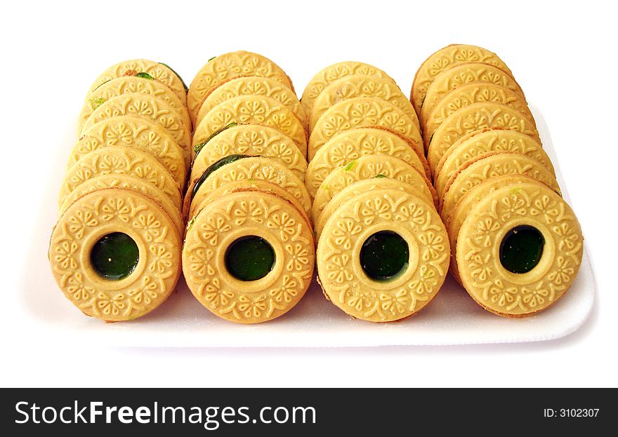 Cookies with kiwi jelly over white background