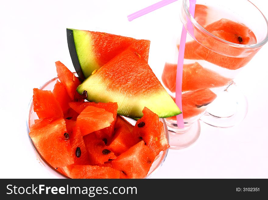 Background of brightly lit red watermelon slices. Background of brightly lit red watermelon slices.