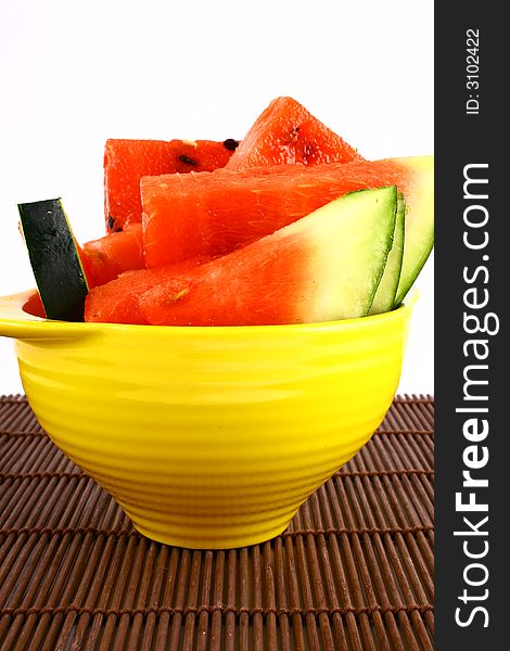 Background of brightly lit red watermelon slices.