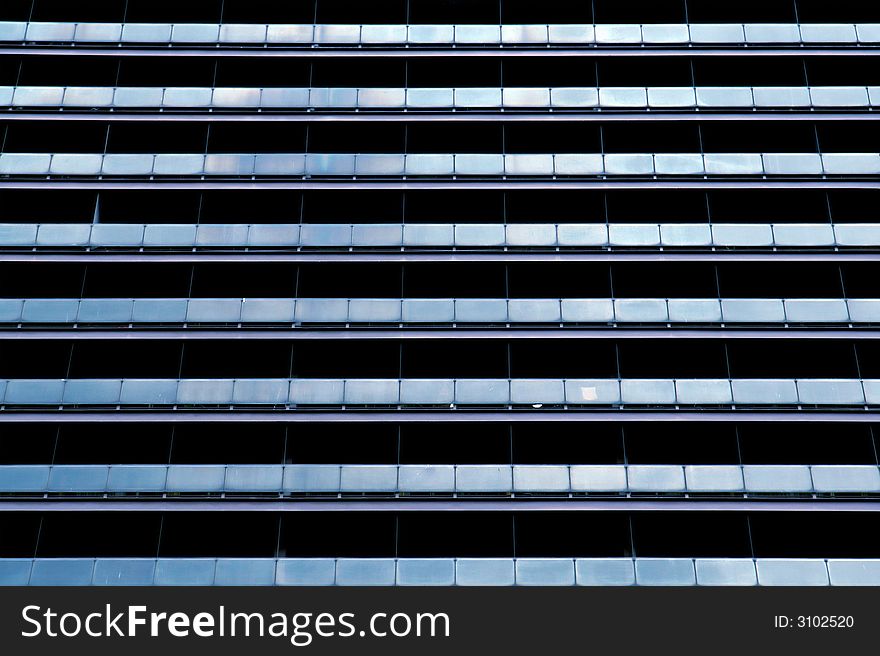 Blue windows of a business building in a row. Blue windows of a business building in a row