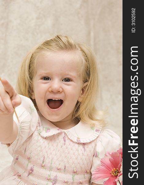 An excited beautiful girl pointing with laughter. An excited beautiful girl pointing with laughter