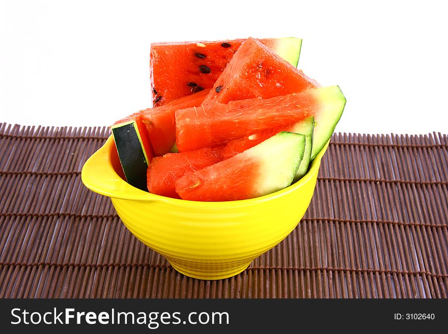 Background of brightly lit red watermelon slices.