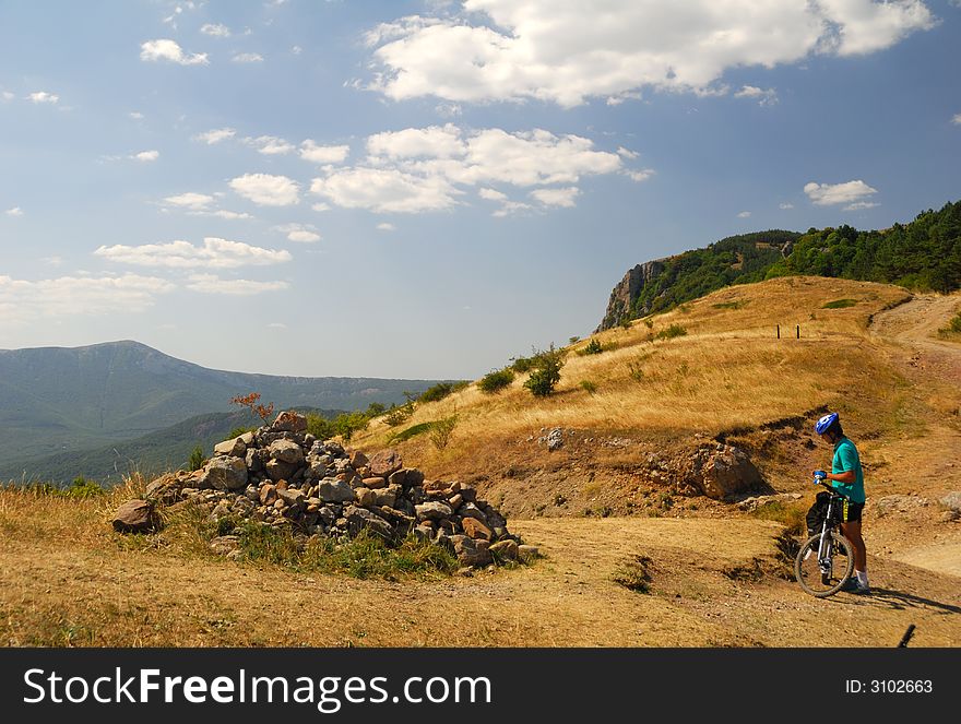 Biker in mountains. ( Dimerdzhi mountain in Crimea, Ukraine)